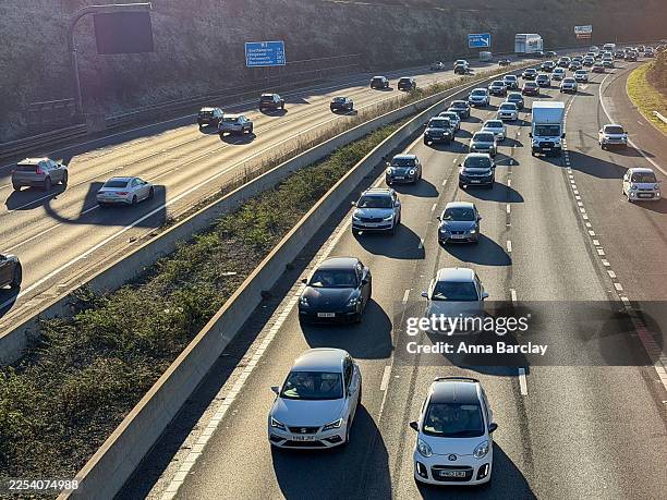 Vehicles queue in a traffic jam on the M3 motorway on December 27, 2025 near Winchester, England. The M3 motorway, which links the seaports of...