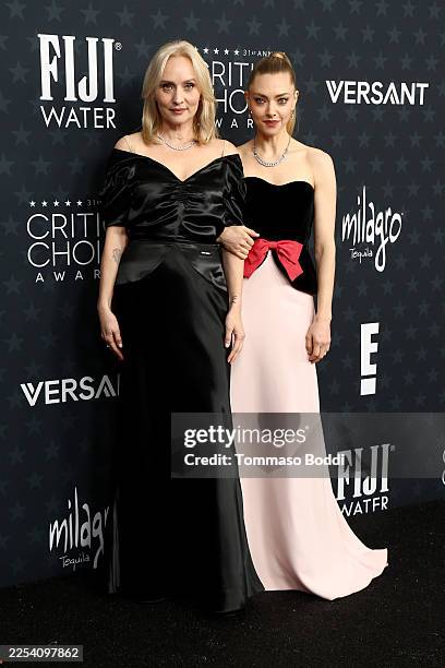 Mona Fastvold and Amanda Seyfried at the 31st Annual Critics Choice Awards held at the Barker Hangar on January 04, 2026 in Santa Monica, California.
