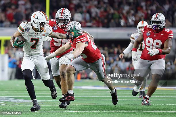 Daniels of the Miami Hurricanes runs with the ball in the fourth quarter against the Ohio State Buckeyes during the 2025 College Football Playoff...