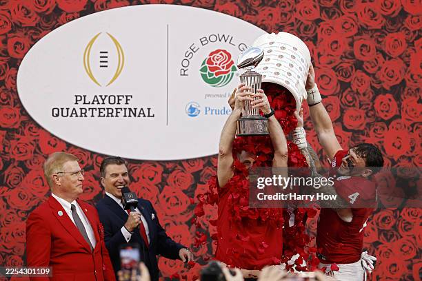 Head coach Curt Cignetti of the Indiana Hoosiers celebrates with the Leishman Trophy after defeating the Alabama Crimson Tide 38-3 in the College...