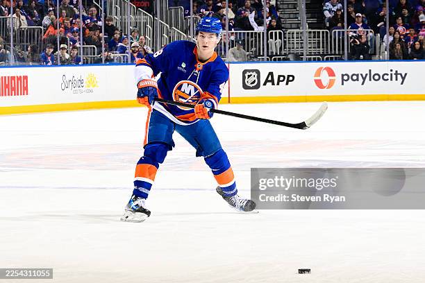 Matthew Schaefer of the New York Islanders passes the puck against the Utah Mammoth during the game at UBS Arena on January 01, 2026 in Elmont, New...