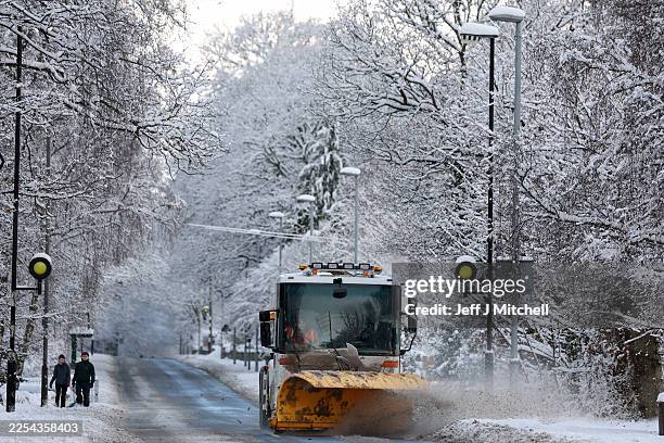 Snow plough is seen on the A93 as an 'amber' snow warning was issued on January 02, 2026 in Aboyne, Scotland. Severe conditions were forecast in...