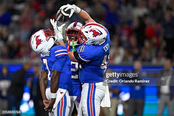Stone Eby of the Southern Methodist University Mustangs celebrates with Kevin Jennings after scoring a touchdown against the Arizona Wildcats during...