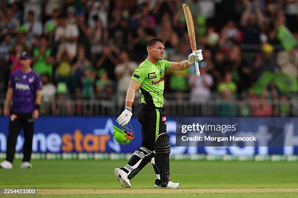 David Warner of the Thunder celebrates scoring a century during the BBL match between Sydney Thunder and Hobart Hurricanes at ENGIE Stadium, on...
