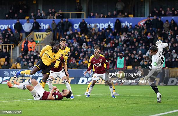 Alphonse Areola of West Ham United makes a save from Tolu Arokodare of Wolverhampton Wanderers during the Premier League match between Wolverhampton...
