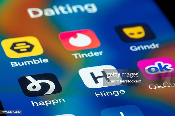 popular dating applications icons displayed on a smartphone screen - dating app stock pictures, royalty-free photos & images