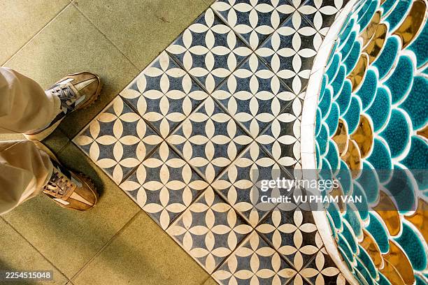 old-fashioned flooring with plain and patterned tiles - enamel surface stock pictures, royalty-free photos & images