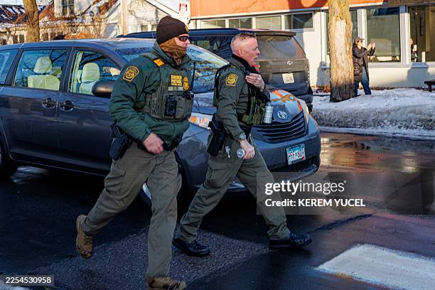 Border Patrol Commander Gregory Bovino walks near Roosevelt High School during dismissal time as federal immigration enforcement actions sparked...
