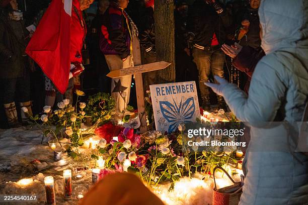 Memorial set up by community members during a vigil following a fatal shooting by an Immigration and Customs Enforcement agent in Minneapolis,...