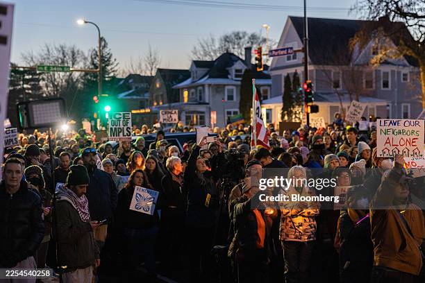 Community members during a vigil following a fatal shooting by an Immigration and Customs Enforcement agent in Minneapolis, Minnesota, US, on...