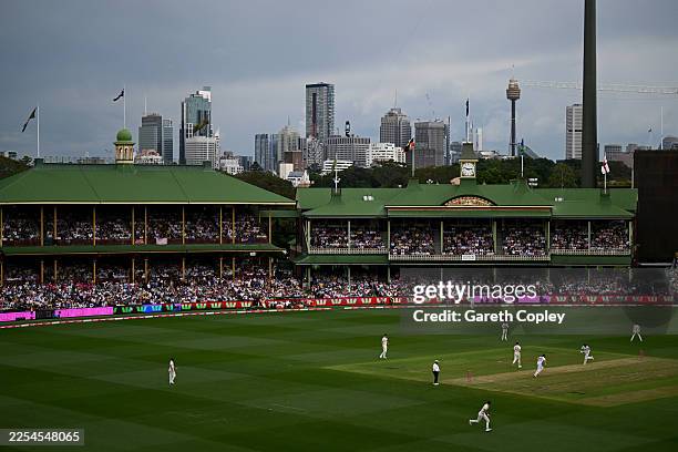 Harry Brook and Joe Root of England run between the wickets during day one of the Fifth Test in the 2025/26 Ashes Series between Australia and...