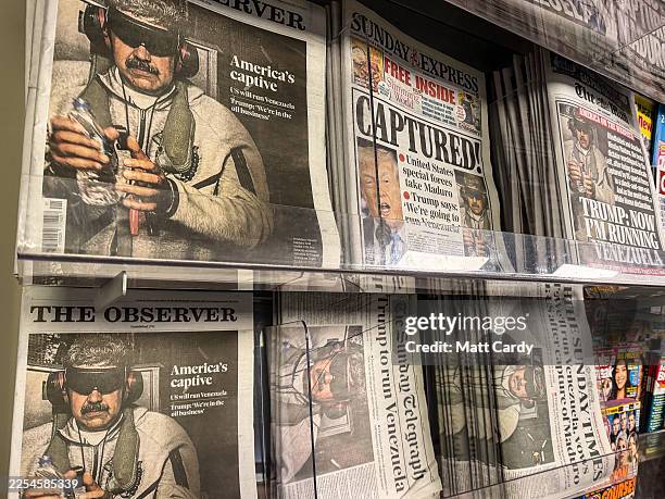 Newspaper front pages display stories on the capture and arrest of President Nicolas Maduro from Venezuela in a newsagent shop, on January 4, 2026 in...