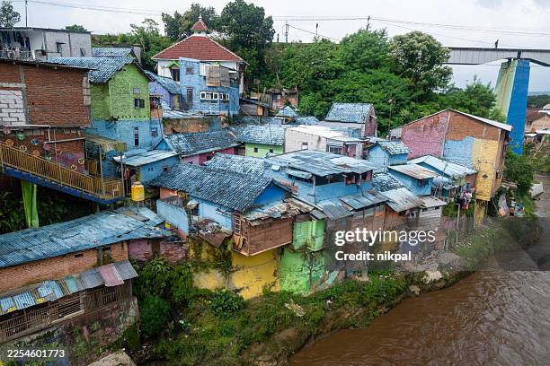 the colorful village of jodipan seen from above with a drone, east java, indonesia. - surabaya stock pictures, royalty-free photos & images