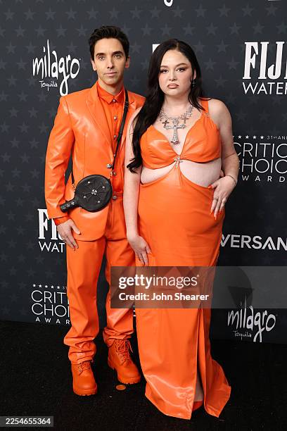 Paul W. Downs and Megan Stalter attend the 31st Annual Critics Choice Awards at Barker Hangar on January 04, 2026 in Santa Monica, California.