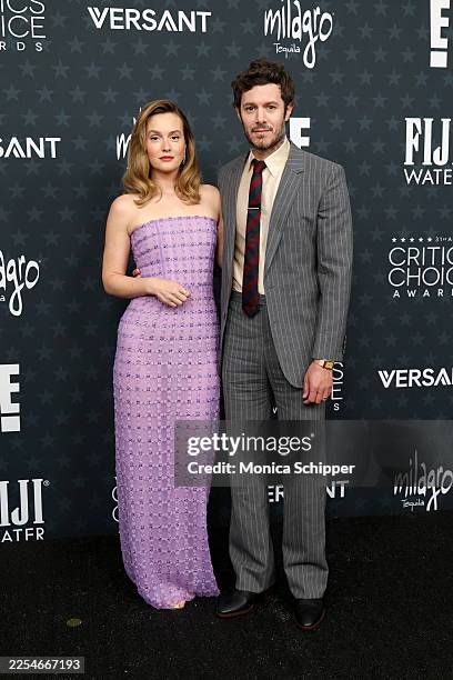 Leighton Meester and Adam Brody attend the 31st Annual Critics Choice Awards at Barker Hangar on January 04, 2026 in Santa Monica, California.