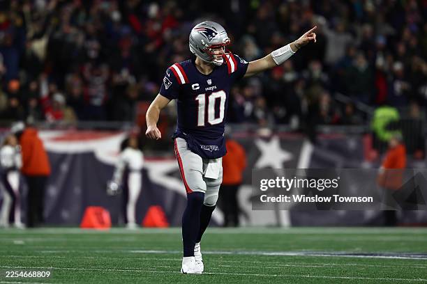 Drake Maye of the New England Patriots celebrates after a touchdown in the third quarter against the Miami Dolphins at Gillette Stadium on January...