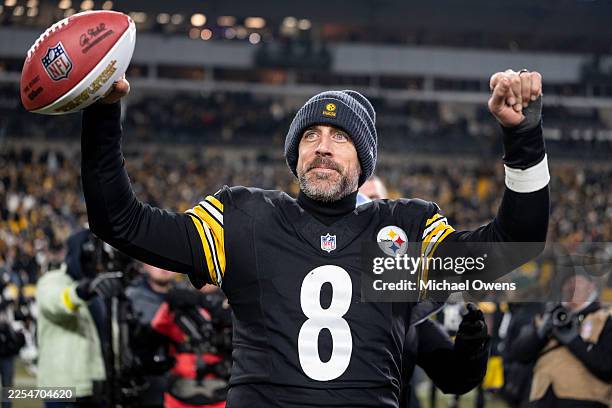 Aaron Rodgers of the Pittsburgh Steelers celebrates following an NFL football game against the Baltimore Ravens at Acrisure Stadium on January 04,...