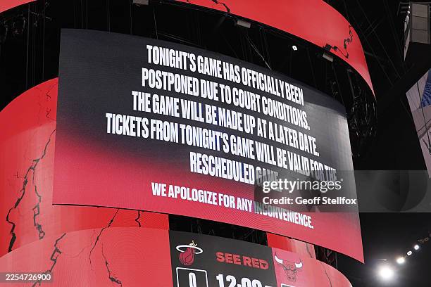View of a post made by the Chicago Bulls organization on the Jumbotron to notify fans that the game against the Miami Heat has been postponed at the...