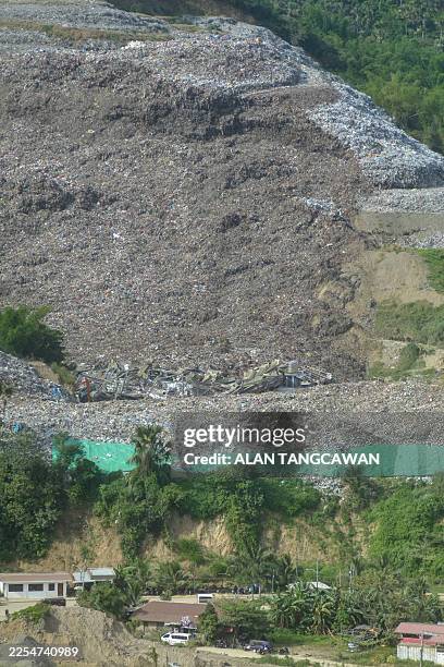 An aerial view shows a landslide at the landfill in Barangay Binaliw, Cebu City on January 9, 2026. Rescue workers searched on January 9 for dozens...