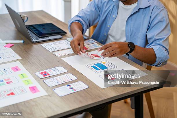 ux designer creating mobile app wireframes and prototypes - web prototype stock pictures, royalty-free photos & images
