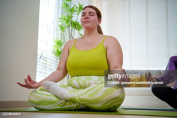 joyful plus size woman embracing nature and digital detox during outdoor workout - big hug stock pictures, royalty-free photos & images