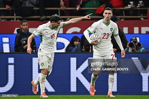 Morocco's forward Brahim Diaz celebrates scoring his team's first goal during the Africa Cup of Nations quarter-final football match between Cameroon...