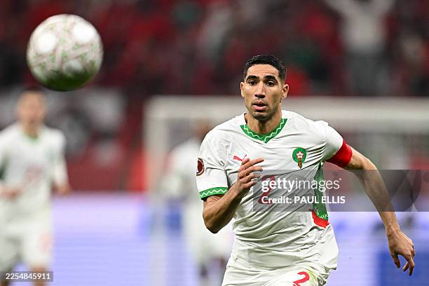 Morocco's defender Achraf Hakimi eyes the ball during the Africa Cup of Nations quarter-final football match between Cameroon and Morocco at the...