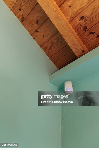 motion sensor under wooden celling, light on - motion detector stock pictures, royalty-free photos & images