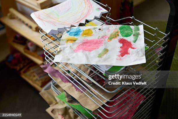 paper with pen and marker drawings on shelf - chaotic classroom stock pictures, royalty-free photos & images
