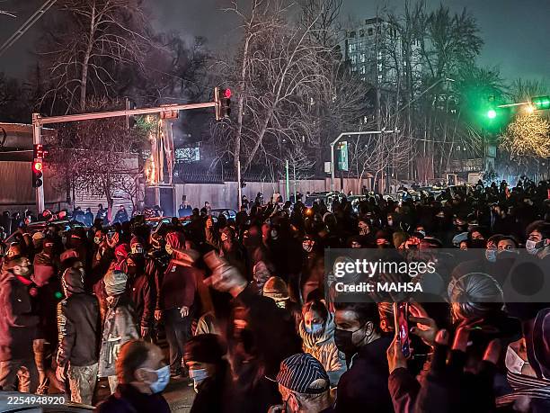 Iranians gather while blocking a street during a protest in Tehran, Iran on January 9, 2026. The nationwide protests started in Tehran's Grand Bazaar...