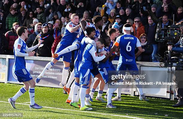 Macclesfield Town's Isaac Buckley-Ricketts celebrates scoring his sides second goal during the Emirates FA Cup third round match at the Leasing.com...