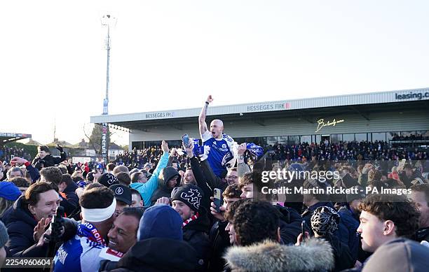 Macclesfield FC's Josh Kay celebrates with fans following the Emirates FA Cup third round match at the Leasing.com Stadium, Macclesfield. Picture...