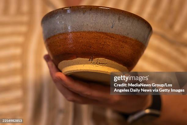 Pasadena, CA Rachel Barth shows an example ash bowl for Eaton fire survivors at her A-Frame Pottery studio in Pasadena on Monday, January 5, 2026...