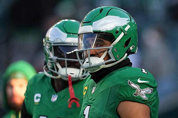 Jalen Hurts and A.J. Brown of the Philadelphia Eagles look on prior to the game against the Washington Commanders at Lincoln Financial Field on...