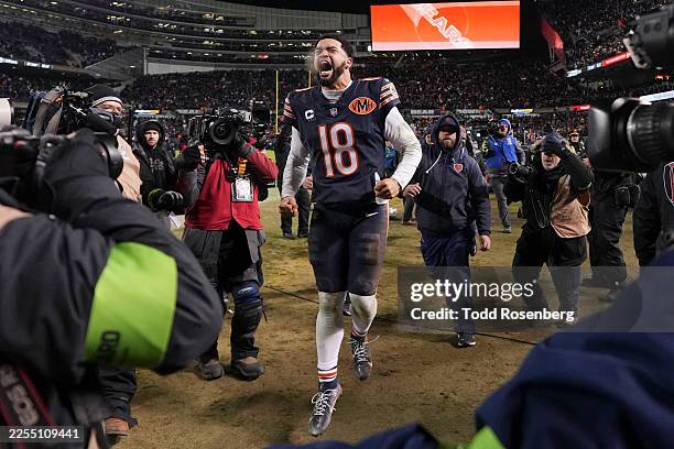 Caleb Williams of the Chicago Bears celebrates after an NFL Wild Card game against the Green Bay Packers at Solider Field on January 10, 2026 in...
