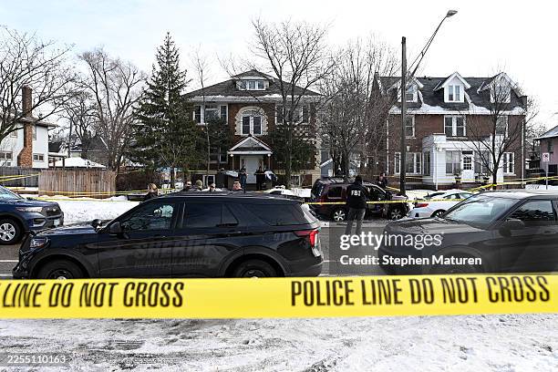 Members of law enforcement work the scene following a suspected shooting by an ICE agent during federal law enforcement operations on January 07,...