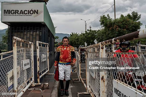 Demonstrator dressed as Simón Bolívar crosses the Simon Bolivar bridge in the Colombia-Venezuela border on January 7, 2026 in Cucuta, Colombia. After...