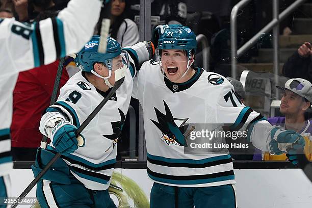 Macklin Celebrini of the San Jose Sharks celebrates a goal with Dmitry Orlov against the Los Angeles Kings during the third period at Crypto.com...
