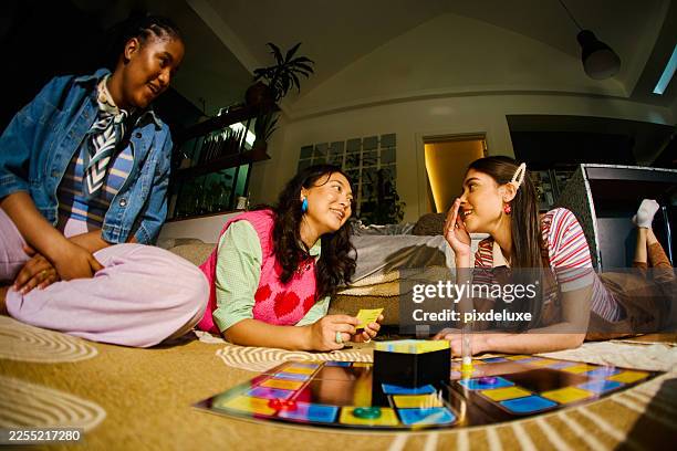 gen z friends enjoying board game night at home - analog stock pictures, royalty-free photos & images