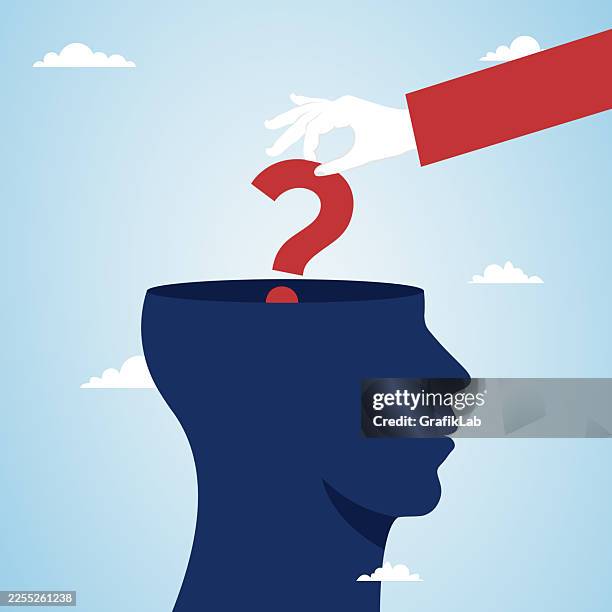 suited arm placing a red question mark into a blue human head silhouette - philosophy stock illustrations