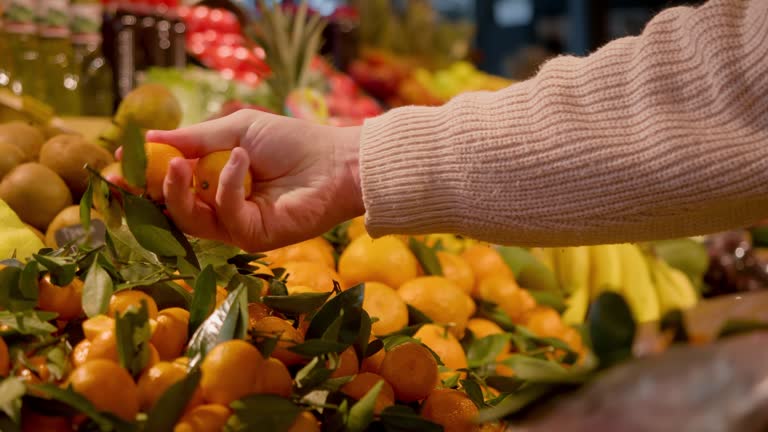 https://media.gettyimages.com/id/2255270773/video/hand-picking-bright-mandarins-among-lush-green-leaves-outdoors-shopper-carefully-chooses-ripe.jpg?b=1&s=640x640&k=20&c=5MLKGMPQQJo8SOSNdADJBp7Wks9t_bnayHvcIOxAQiw=