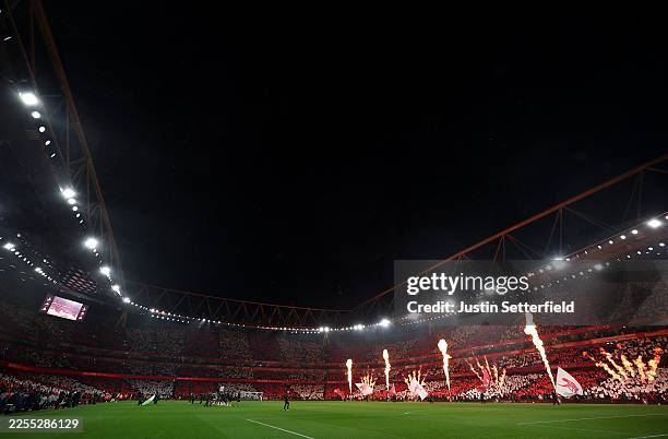 Fans display a Tifo as fireworks are released prior to the Premier League match between Arsenal and Liverpool at Emirates Stadium on January 08, 2026...