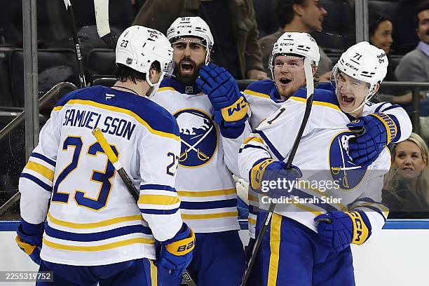Alex Tuch, Bowen Byram, and Ryan McLeod react with Mattias Samuelsson of the Buffalo Sabres after his goal during the third period against the New...