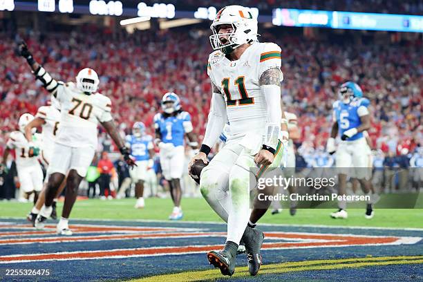 Carson Beck of the Miami Hurricanes scores a touchdown against the Ole Miss Rebels in the fourth quarter during the 2025 College Football Playoff...