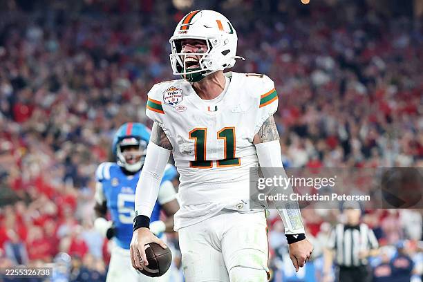 Carson Beck of the Miami Hurricanes celebrates a touchdown against the Ole Miss Rebels in the fourth quarter during the 2025 College Football Playoff...