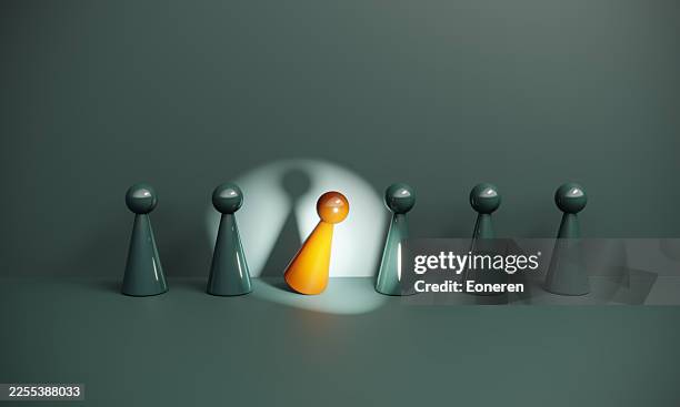 spotlight on individuality within a group - local authority stock pictures, royalty-free photos & images