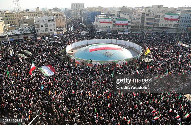 People gather at Enghelab Square after a government call to rally against recent protests across the country, chanting anti-U.S. And anti-Israel...