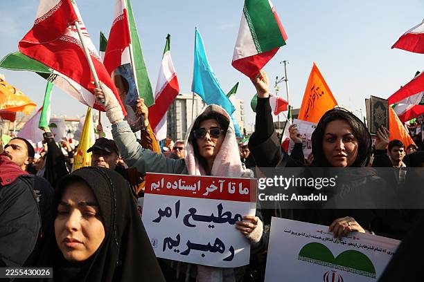 People gather at Enghelab Square after a government call to rally against recent protests across the country, chanting anti-U.S. And anti-Israel...