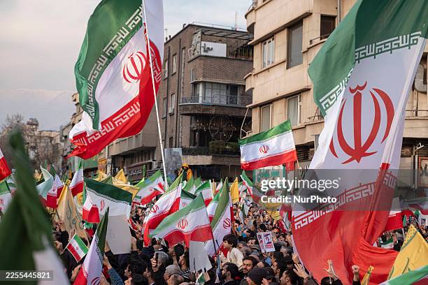 Iranian protesters participate in a pro-Government rally in Tehran, Iran, on January 12, 2026. The rally takes place in Tehran against the recent...