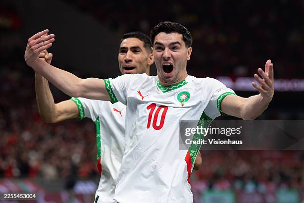Brahim Diaz of Morocco celebrates scoring the opening goal with Achraf Hakimi during the Africa Cup Of Nations Quarter-final match between Cameroon...